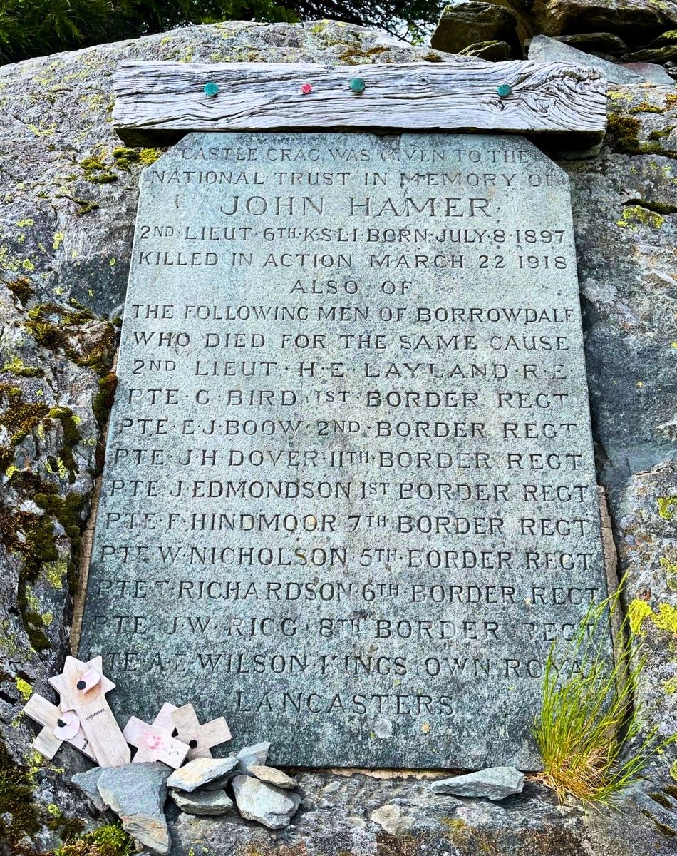 Slate memorial plaque set into rock at Castle Crag in Borrowdale, dedicated to John Hamer and local soldiers who died in the First World War.