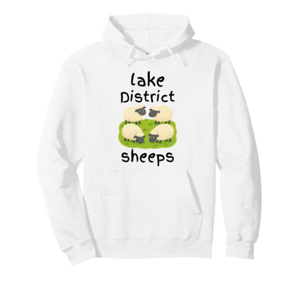 A white hoodie featuring a cute cartoon illustration of four sheep grazing on a green patch of grass, with the text 'lake District' above and the playful, intentional misspelling 'sheeps' written below.