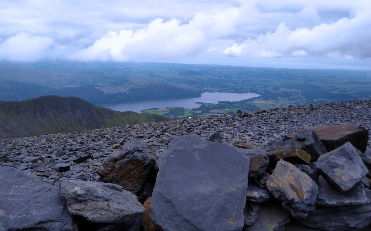 Summit views from the Skiddaw walking route near Keswick. View of Bassenthwaite Lake and surrounding countryside from the stone shelter on Skiddaw summit plateau.
